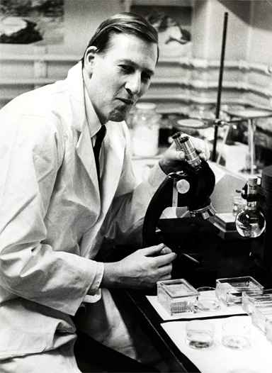 Dr. Roger Bannister working in the lab at Harvard University in 1962.
